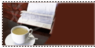 photo of cup and saucer in front of papers