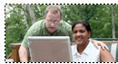 man and woman using laptop computer